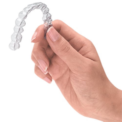 hand holding an invisalign aligner