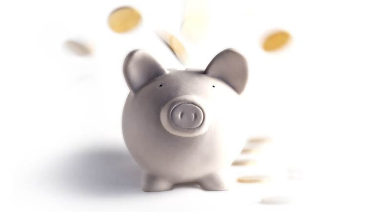 piggy bank with coins in motion